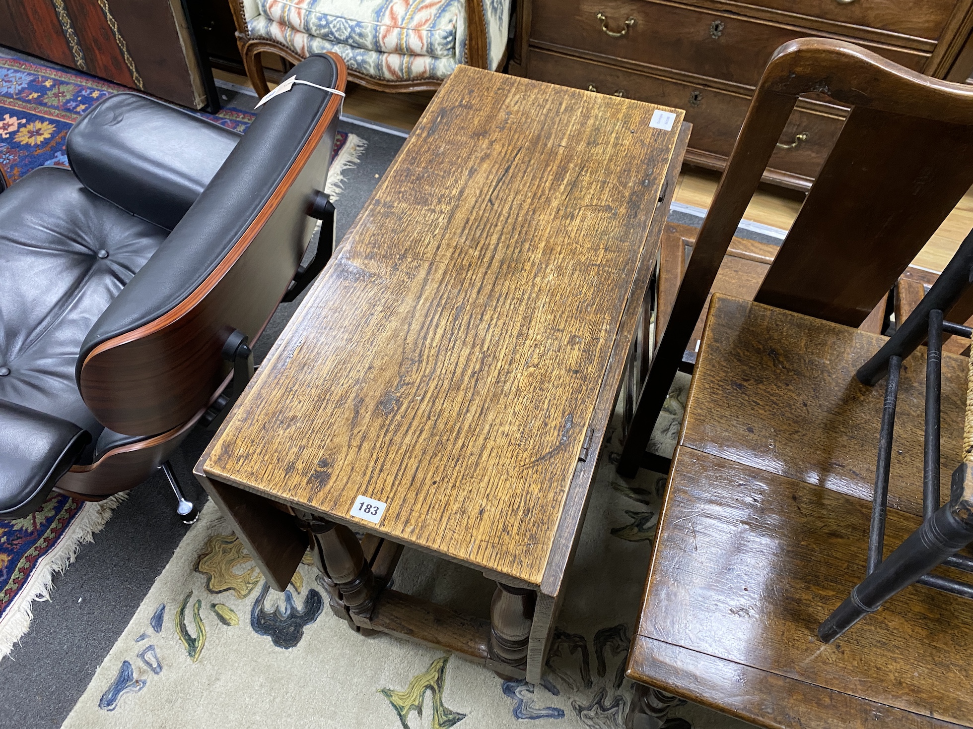 A late 17th century William and Mary oak rectangular gateleg table, the four baluster turned supports with split profile gatelegs, width 77cm, depth 41cm, height 74cm